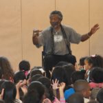 BankRI hosts renowned storyteller STORYTELLER LEN CABRAL performed his stories to students at the Lillian Feinstein Elementary School at Sackett Street in Providence. / COURTESY BANK RI