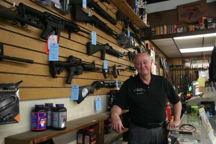 OFF TARGET? Bullseye Shooting Supplies owner Paul Connolly has been in the firearms business for 35 years. He says stricter gun-control measures would “make criminals out of law-abiding citizens.” / PBN PHOTO/MICHAEL PERSSON