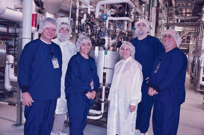 Amgen encourages innovation at its Rhode Island site, such as this team that is celebrating implementing a pasteurization technology to improve product delivery. / COURTESY AMGEN Amgen encourages innovation at its Rhode Island site, such as this team that is celebrating implementing a pasteurization technology to improve product delivery. / COURTESY AMGEN