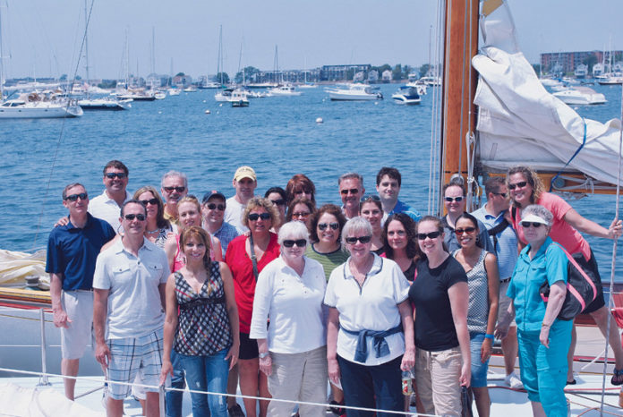 THE TEAM THAT STAYS TOGETHER: Provider Group employees engaged in team-building activities at last year’s summer appreciation outing, which honors people who have reached five-year milestones, among others. / COURTESY PROVIDER GROUP THE TEAM THAT STAYS TOGETHER: Provider Group employees engaged in team-building activities at last year’s summer appreciation outing, which honors people who have reached five-year milestones, among others. / COURTESY PROVIDER GROUP