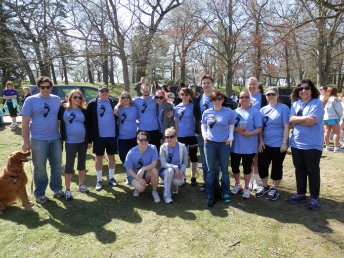 A FRIENDLY STROLL: Partridge Snow & Hahn staff took part earlier this year in the Children&rsquo;s Friend Walk and Run, held at the Roger Williams Park Zoo in Providence. / COURTESY PARTRIDGE SNOW & HAHN