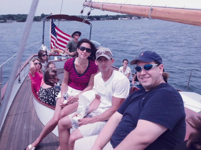 ON THE WATER: For DiSanto, Priest & Co.&rsquo;s annual summer outing last July, employees took a schooner on a cruise of Narragansett Bay. / COURTESY DISANTO PRIEST