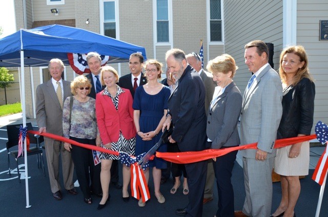 STATE LEADERS JOIN THE PROVIDENCE Center on Monday to celebrate the opening on the Joyce House. From left: Gov. Lincoln D. Chafee, Nancy Beely of Ocean State Job, Sen. Sheldon Whitehouse, Mary Fasano of Citizens Bank Charitable Foundation, Mayor Angel Taveras, Megan Smith, Paul Metro of Electric Boat Corp. Employees' Community Services Assoc., Nat and Ellen Calamis, Dale Klatzker, Marianne Holmes, Ken Knox and Donna Monatquilla of Northwest Woolen Mills. / COURTESY THE PROVIDENCE CENTER STATE LEADERS JOIN THE PROVIDENCE Center on Monday to celebrate the opening on the Joyce House. From left: Gov. Lincoln D. Chafee, Nancy Beely of Ocean State Job, Sen. Sheldon Whitehouse, Mary Fasano of Citizens Bank Charitable Foundation, Mayor Angel Taveras, Megan Smith, Paul Metro of Electric Boat Corp. Employees' Community Services Assoc., Nat and Ellen Calamis, Dale Klatzker, Marianne Holmes, Ken Knox and Donna Monatquilla of Northwest Woolen Mills. / COURTESY THE PROVIDENCE CENTER