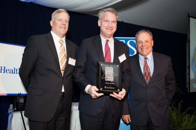 John Galvin, accepts the First Place Award (enterprise category) for Collette Vacations / Rupert Whiteley