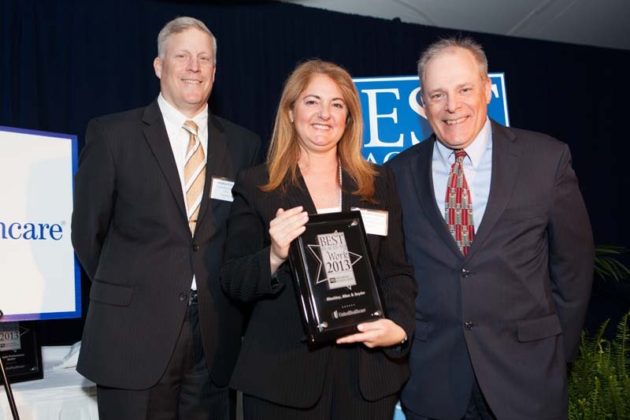 Megan McCormack of Hinckley Allen accepts the firm&rsquo;s first place award (in the mid-size category). / Rupert Whiteley