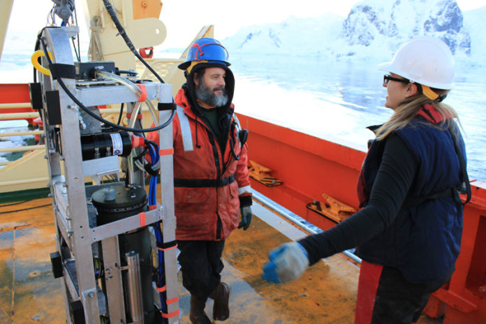 DOWN SOUTH: A URI team worked in collaboration with six scientists from the University of Massachusetts Boston on a cruise of Antarctica to study krill. Pictured above are Jeremy Lucke and Jullie Jackson. / COURTESY CHRISTOPHER ROMAN