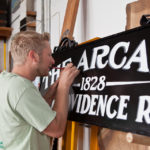 SIGN OF THINGS TO COME: Shawn Gilheeney, above, is co-owner of Providence Painted Signs, a company founded by three local artists with an eye for traditional typefaces. It&rsquo;s currently tackling work for businesses going into the new Arcade. / PBN PHOTO/TRACY JENKINS