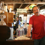 IN TOWN: Charlie Wilson, owner of The Town Trader in Glocester, says that having a responsive, local institution such as Navigant Credit Union has helped him prosper. / PBN PHOTO/MICHAEL PERSSON