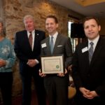 ROBERT BRUNELLE, owner of Main Street Formals, accepts the 2013 small business of the year award from members of the New Bedford Area Chamber of Commerce and BankFive. / COURTESY NEW BEDFORD AREA CHAMBER OF COMMERCE/DEBORAH L. HYNES