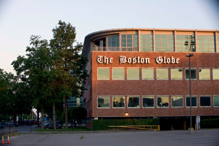 THE NEW YORK TIMES CO. plans to start bids for The Boston Globe at $100 million, a 10th of what it paid for the paper in 1993. / BLOOMBERG FILE PHOTO/MICHAEL FEIN
