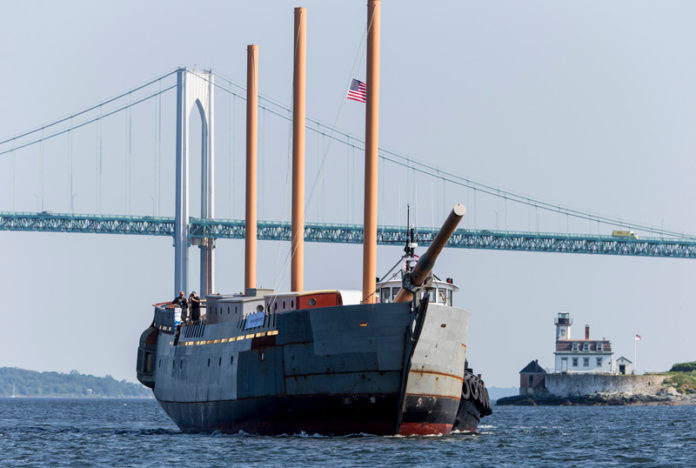 The SSV Oliver Hazard Perry is towed from Senesco Marine in North Kingstown to Newport June 21 for hauling and painting at the Newport Shipyard. The uncompleted tall ship, named after naval war hero Commodore Oliver Hazard Perry, will be dockside at the shipyard for a fundraising event July 5 and at Fort Adams on July 6 and July 7 for public visits. When completed in 2014, the nonprofit educational vessel will have a capacity for 36 students on overnight trips and 85 for day sails. / COURTESY ONNE VAN DER WAL
