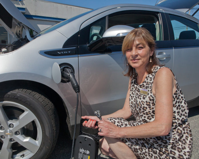 PLUGGED IN: Chevrolet’s Volt – being shown by Paula Gauthier, sales professional at Balise Chevrolet in Warwick – can run on a full charge for 38 miles. / PBN PHOTO/TRACY JENKINS