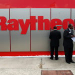 RAYTHEON RAISED its earnings outlook and beat second-quarter profit estimates, the company announced Wednesday. / BLOOMBERG FILE PHOTO/ALASTAIR MILLER