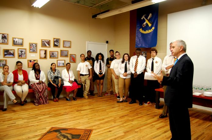 SEN. JACK REED addresses students and trainees from YouthBuild Providence at the YouthBuild Technical Training Center on Manton Avenue in Providence.  Reed announced Monday that YouthBuild Providence has received a $1.1 million federal grant. / COURTESY YOUTHBUILD PROVIDENCE