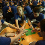 Nonprofit widening path toward entrepreneurship COMING TOGETHER: Venture for America fellows take part in a Lego competition designed to help participants understand team roles and responsibilities, during a training camp at Brown University. / COURTESY EDDIE SHIOMI