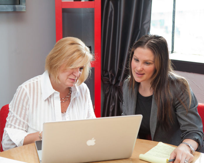 TAKING A GAMBLE: Gail Morris, left, and Stacey Liakos are managing partners at Omnia Agency, the Providence advertising firm the two founded in 2008. The full-service agency specializes in media buying, website development and graphic design. / PBN PHOTO/TRACY JENKINS