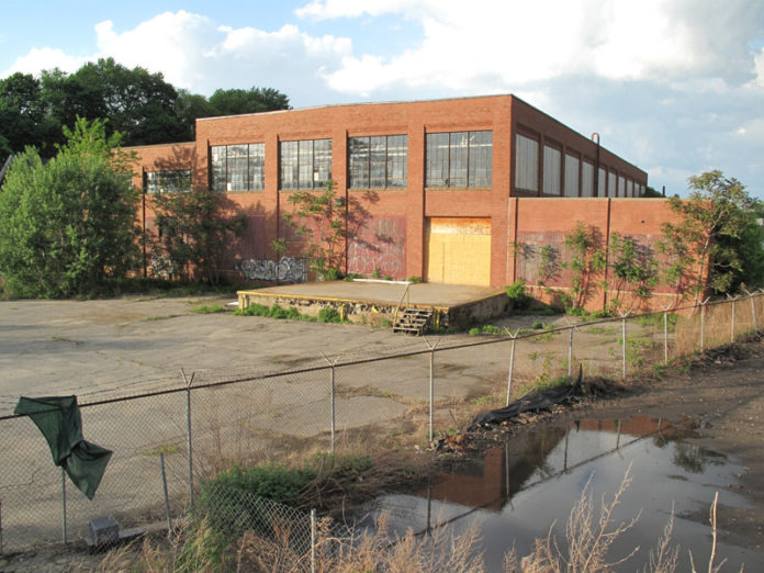 FROM THE ASHES: WaterFire purchased a 27,000-square-foot building at 475 Valley St. in November 2012 and has been awarded $600,000 in brownfield cleanup grants from the U.S. Environmental Protection Agency for the building. / COURTESY WATERFIRE