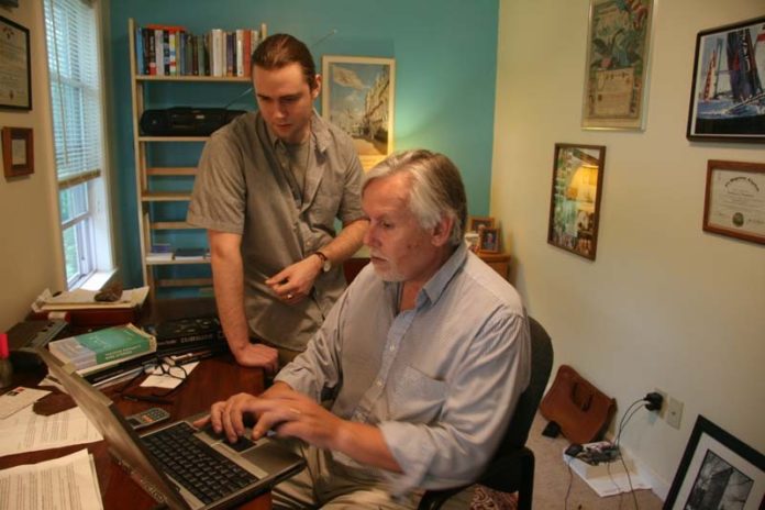 PAPER TRAIL: New Street Communications co-owner Edward Renehan with his son, Bill. Renehan says that for every paper copy bought from the company, it’s selling 10 e-books. / PBN PHOTO/MICHAEL PERSSON