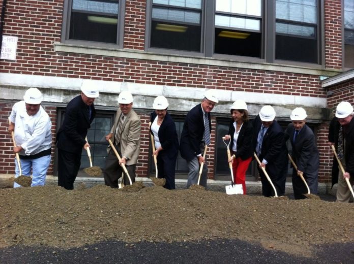 LOCAL OFFICIALS AND MEMBERS of Hope & Main break ground on the nonprofit's new facility, R.I.'s first-ever food business incubator. / COURTESY HOPE & MAIN