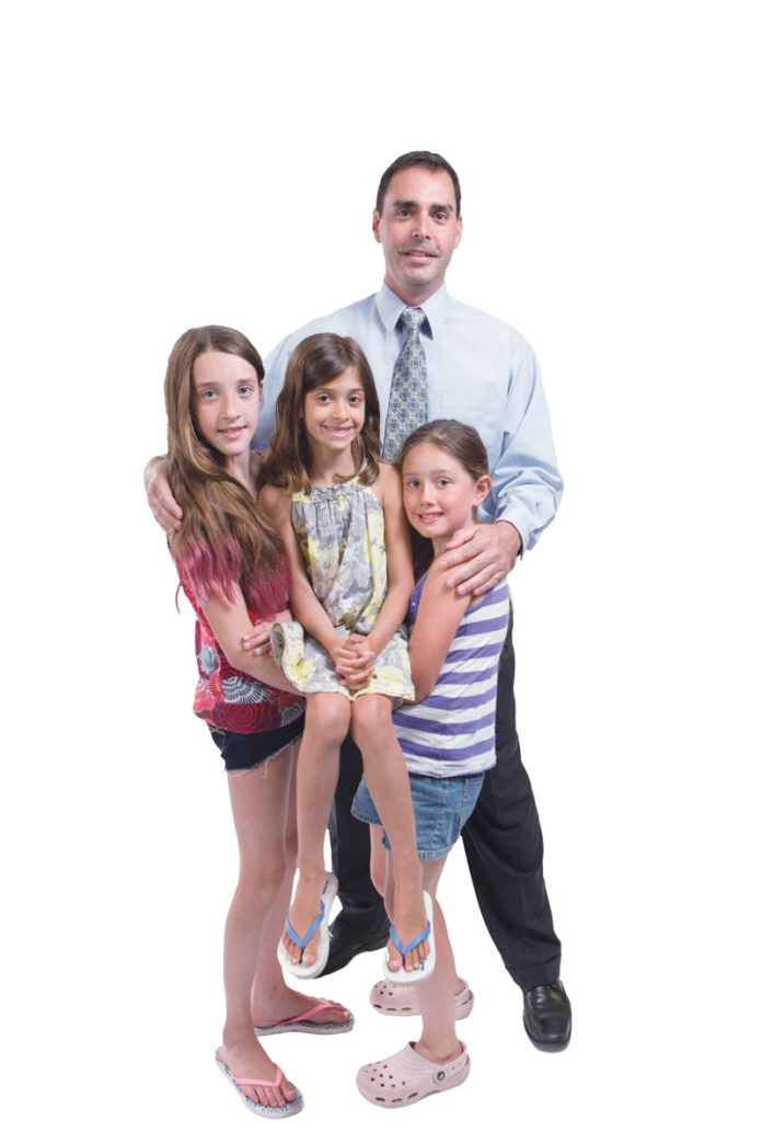 THE PROP: Michael J. Daly poses with his ‘pride and joy,’ daughters, from left:0 Caroline, 11; Lauren, 7; and Ella, 9.