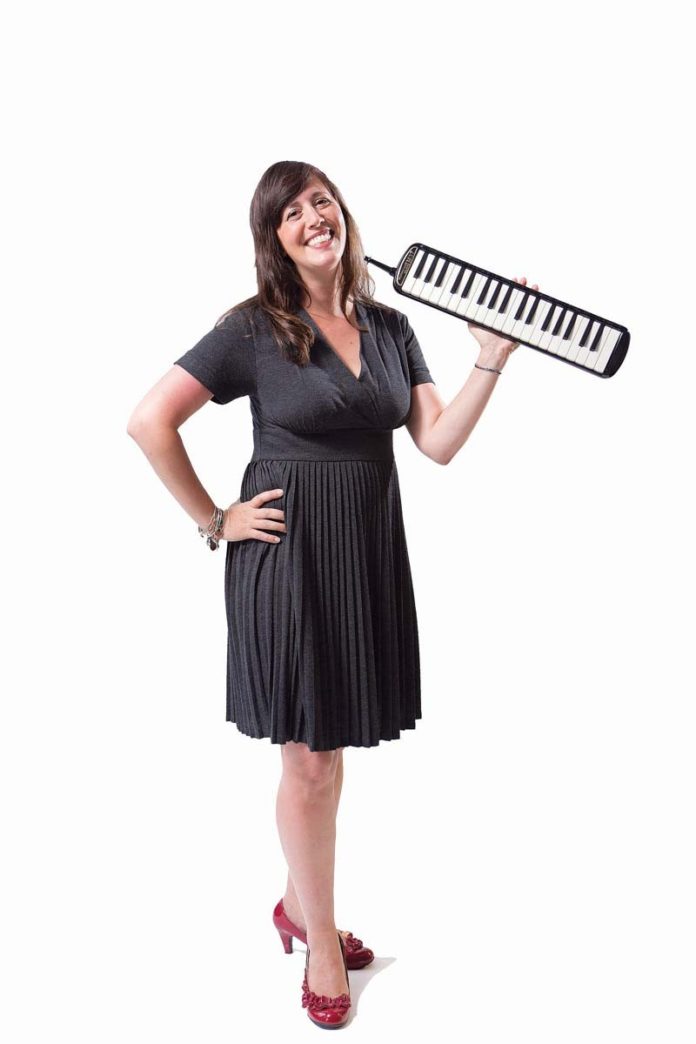 THE PROP: Dana Borelli-Murray plays the melodica in Providence’s The Extraordinary Rendition Band.