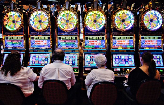 SLOT MACHINE REVENUE declined at Connecticut's two casinos for the 19th consecutive month in July. / BLOOMBERG FILE PHOTO/MIKE MERGEN