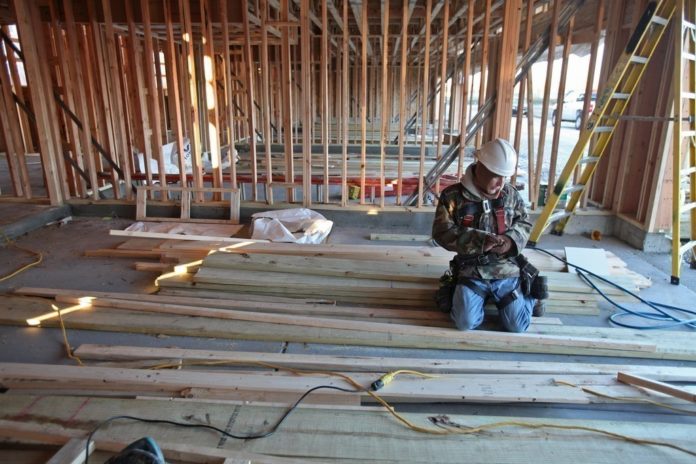 CONSTRUCTION EMPLOYMENT dropped 5 percent in the Providence-Fall River-Warwick area in July. / BLOOMBERG FILE PHOTO/TIM BOYLE
