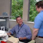 Practical connections have new program flying high HANDS-ON EXPERIENCE: Jonathon Gibson, left, an intern at GTECH, speaks with his superior, Technology Section Manager David Kwasniewski. / PBN PHOTO/BRIAN MCDONALD