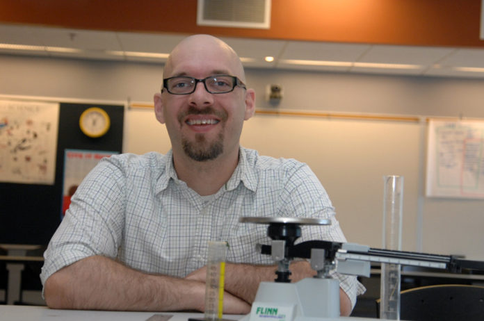 GOLD STANDARD: Rhode Island College Assistant Professor of Science Education and Coordinator of Secondary Science Education Rudolf Kraus says a major focus of the new standards is to engage students in science. / PBN PHOTO/BRIAN MCDONALD