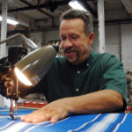REDUCING OVERHEAD: Dave Dansereau operates his Woonsocket Awning Co. under the mantra of &ldquo;all awnings are custom-made by owner on premises.&rdquo; A focus on energy efficiency, as well as a sluggish economy, have helped his business. / PBN PHOTO/BRIAN MCDONALD