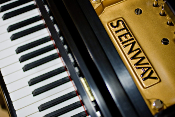 STEINWAY MUSICAL INSTRUMENTS has agreed to a $512 million acquisition by the hedge fund Paulson & Co. / BLOOMBERG FILE PHOTO/DANIEL ACKER