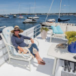 FLOAT ON: Danielle Bolender, manager at Lilypad in Newport Harbor, says the houseboat business has grown into a year-round operation. Lilypad is joined in Rhode Island waters by new arrivals to the Fox Point area in Providence. / PBN PHOTO/TRACY JENKINS