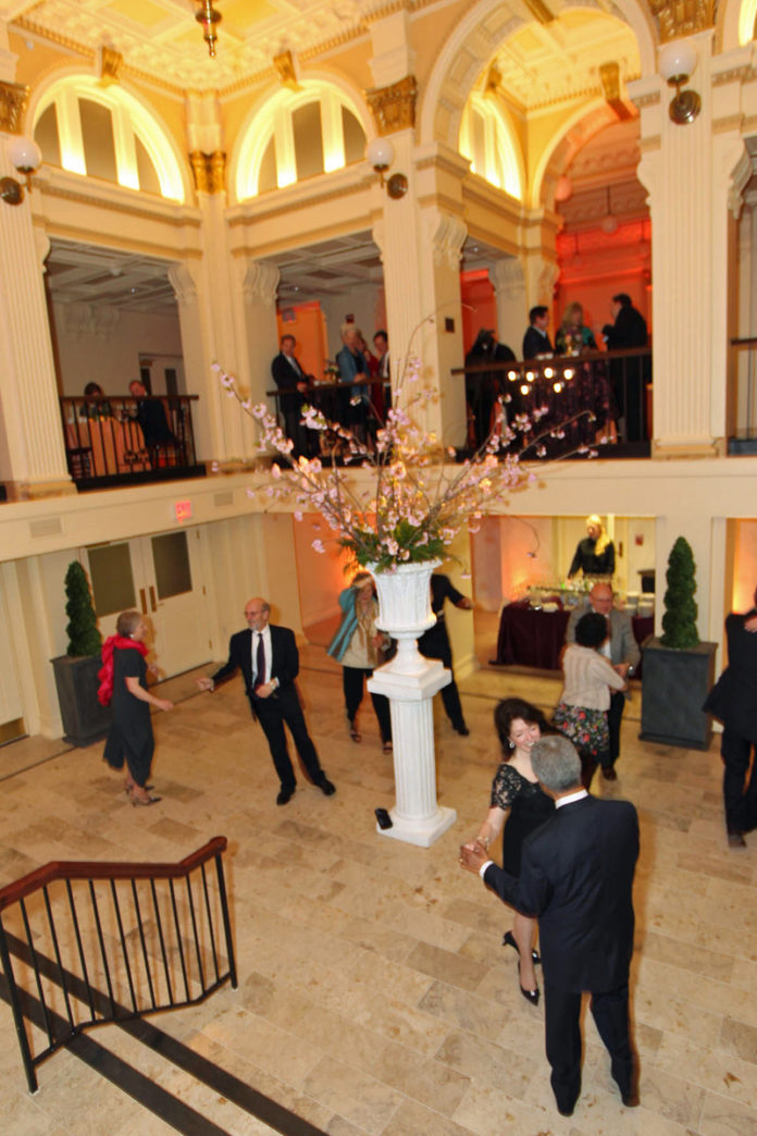 TALK OF THE TOWN: Guests at an April library benefit dance in the renovated Garden Courtyard. / COURTESY AL WEEMS