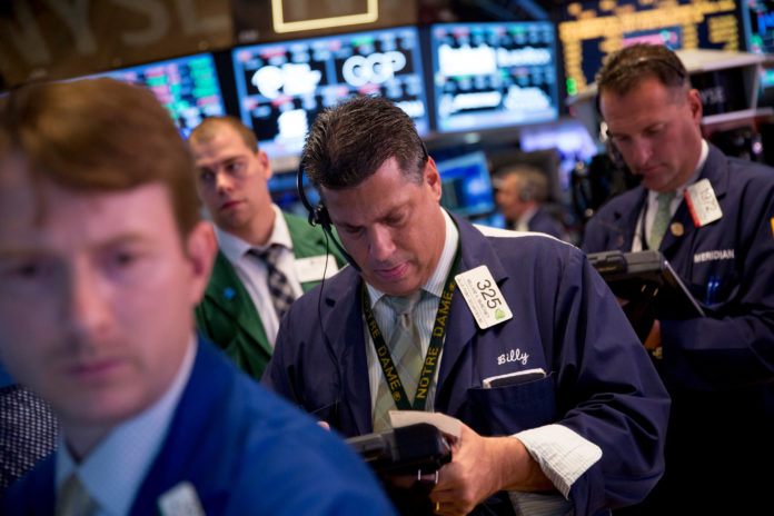 PRICE LEVELS on U.S. equity markets are outpacing profits and reaching multiples last seen when Harry S. Truman was president. Traders work on the floor of the New York Stock Exchange last week. / BLOOMBERG NEWS FILE PHOTO/SCOTT EELLS
