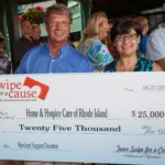 Home & Hospice Care<br>
partners with Swipe ANDY KINNECOM of Swipe for a Cause presents Diana Franchitto of HHCRI with a check to help provide end-of-life care in Rhode Island.