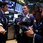 TRADERS WORK ON the floor of the New York Stock Exchange. U.S. stock-index futures rose Monday after Lawrence Summers, President Obama's pick to replace Ben Bernanke as Fed chair, withdrew from the race. / BLOOMBERG NEWS FILE PHOTO/JIN LEE