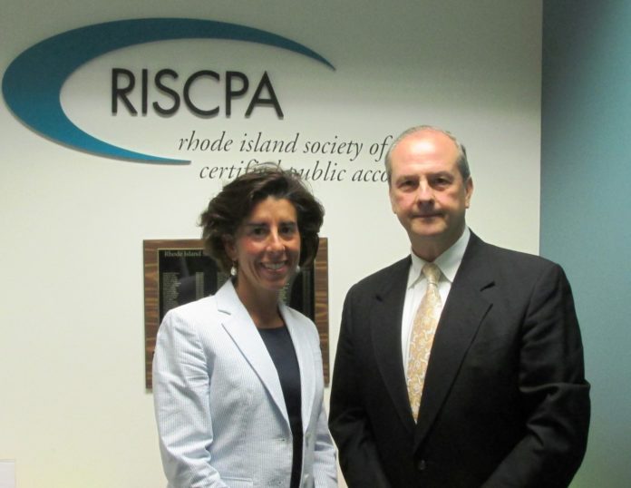 RHODE ISLAND GENERAL TREASURE GINA RAIMONDO and Rhode Island Society of Certified Public Accountants Executive Director Robert Mancini participated in a RISCPA meeting in Providence that showcased the work the volunteer Financial Coaching Corps.