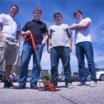 URI ENGINEERING STUDENTS Glenn Bautista, Shawn Fineout, Mike Maher and Tim Pheland display the asphalt compactor they designed for their senior project in 2012 for Richmond-based Vibco. The students developed a device designed to compact asphalt patch more effectively so the patch lasts three times longer than traditional methods. The Business Engagement Center is expected to give business and industry a single point of entry to make these types of business connections happen more efficiently.  / COURTESY UNIVERSITY OF RHODE ISLAND/MICHAEL SALERNO