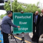PAWTUCKET MAYOR Donald R. Grebien, from left, RIDOT Director Michael Lewis and Gov. Lincoln D. Chafee unveil the official sign for the Pawtucket River Bridge, formerly denominated as Bridge 550. / COURTESY PAWTUCKET MAYOR'S OFFICE