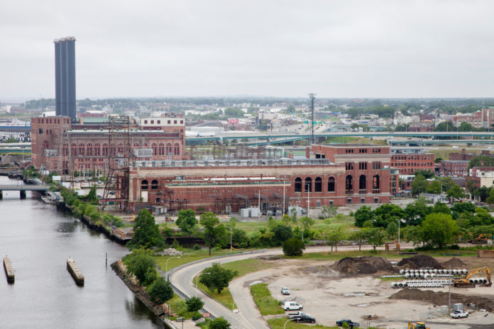 THE INTERSTATE 195 REDEVELOPMENT DISTRICT COMMISSION is considering supporting a citizen-backed plan to bury the power lines leading from Providence's Manchester Street Power Station (in background) to East Providence, thus removing them from India Point Park. / PBN FILE PHOTO/NATALJA KENT