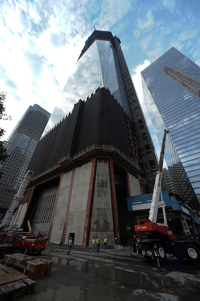 ONE WORLD TRADE CENTER is constructed beside the north pool of The National September 11 Memorial and Museum in New York, U.S., on Aug. 25, 2011. / BLOOMBERG FILE PHOTO/PAUL GOGUEN