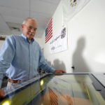 Bar codes help military
keep gear in good order MAKING ITS MARK: A2B Tracking Solutions is a key component of a Defense Department effort to identify and track every piece of hardware it has using laser-etched bar code such as the one Glenn Hamblet is generating at the company’s Portsmouth facility. / PBN PHOTO/BRIAN MCDONALD