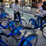 RIDERS TRY OUT the New York City bicycle sharing program in May 2013. The city of Providence this week began soliciting proposals for a similar system for neighborhoods including Downcity, College Hill and Federal Hill. / BLOOMBERG FILE PHOTO/VICTOR J. BLUE
