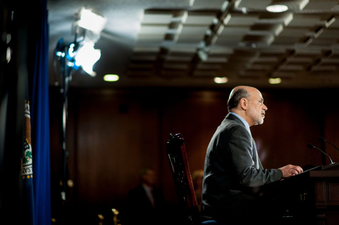 BEN S. BERNANKE, chairman of the U.S. Federal Reserve, speaks during a news conference following the Federal Open Market Committee meeting in Washington, D.C., on Wednesday. The Federal Reserve unexpectedly refrained from reducing the $85 billion pace of monthly bond buying, saying it needs to see more signs of lasting improvement in the economy. / BLOOMBERG NEWS PHOTO/PETE MAROVICH