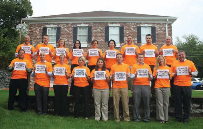 PANERA BREAD/HOWLEY BREAD GROUP staff wear orange to show support for hunger relief and Feeding America's 