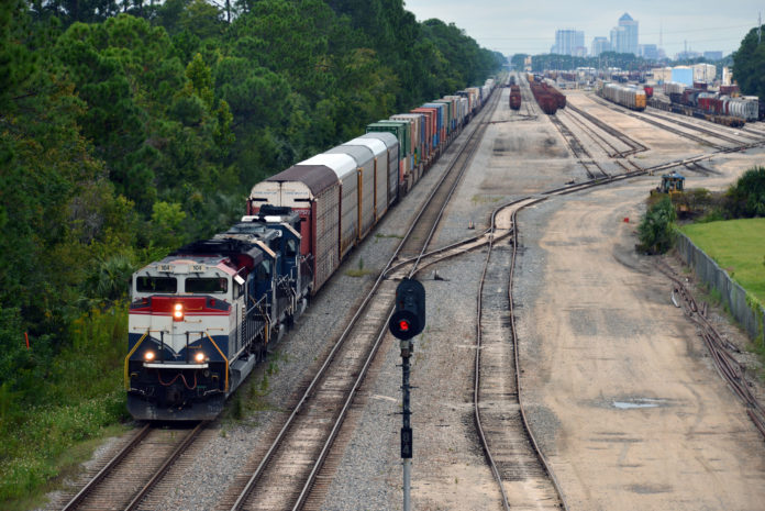 SECOND-QUARTER ECONOMIC GROWTH remained strong in the final revision of GDP data by the Commerce Department. Here a Florida East Coast Railway train departs the railway's Bowden Yard in Jacksonville, Fla., as part of a network of intermodal shipment centers. / BLOOMBERG NEWS PHOTO/MARK ELIAS
