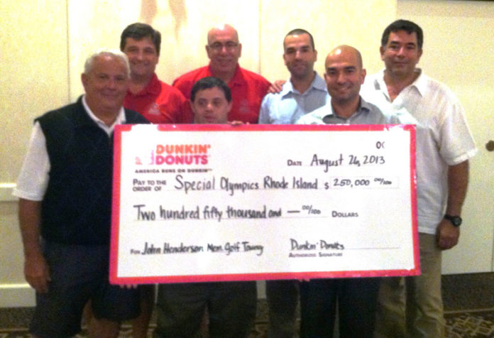 DUNKIN’ DONUTS FRANCHISEES present a check to representatives of Special Olympics Rhode Island before discovering donations exceeded their goal. Back row from second to right: Cliff Prazeres and Joe Prazeres; front row, on right: Chris Prazeres, Dunkin’ Donuts franchisees and co-founders of the John Henderson Invitational Golf Tournament.