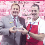 STATELY AFFAIR: Duke Marcoccio, right, owner of Cranston-based My Little Town, gives a replica of the original Rhode Island Statehouse to Eastern States Exposition President and CEO Eugene Cassidy. / COURTESY MY LITTLE TOWN