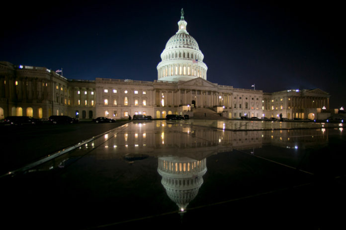 AFTER THE U.S. SENATE rejected House amendments to a government spending bill yesterday, the federal government began to shut down for the first time in 17 years. IHS Inc. estimates that a week-long shutdown could cut annualized growth by 0.2 percentage point. / BLOOMBERG FILE PHOTO/ANDREW HARRER