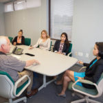 Entrepreneurial success followed father’s advice MORE THAN WORDS: Emily S. Harrington, right, president and CEO of Qualified Resources International, has worked to carry on the entrepreneurial spirit instilled in her by her late father. / PBN PHOTO/TRACY JENKINS